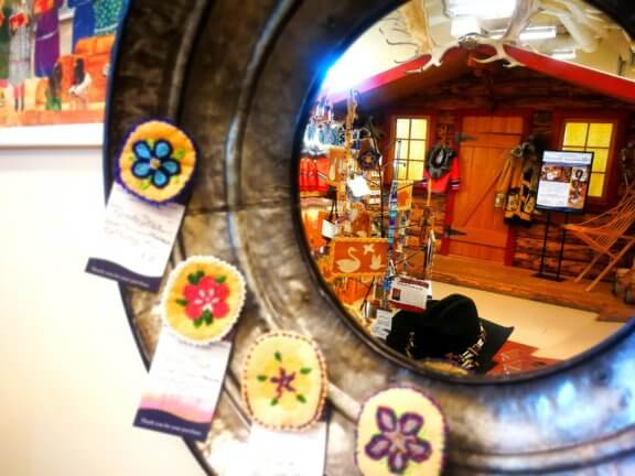 Photo of products reflected in the gift shop mirror