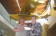 Couple posing with donation check