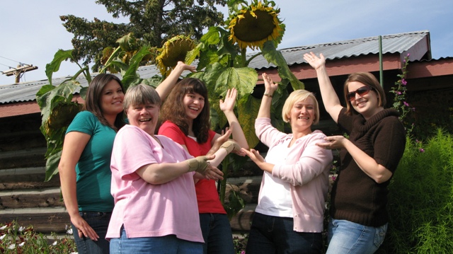 Explore Fairbanks staffers Ginessa Peter, Corrine Jankowski, Ashley Ritenour, Helen Renfrew and Kasey Gillam show off our giant sunflower.