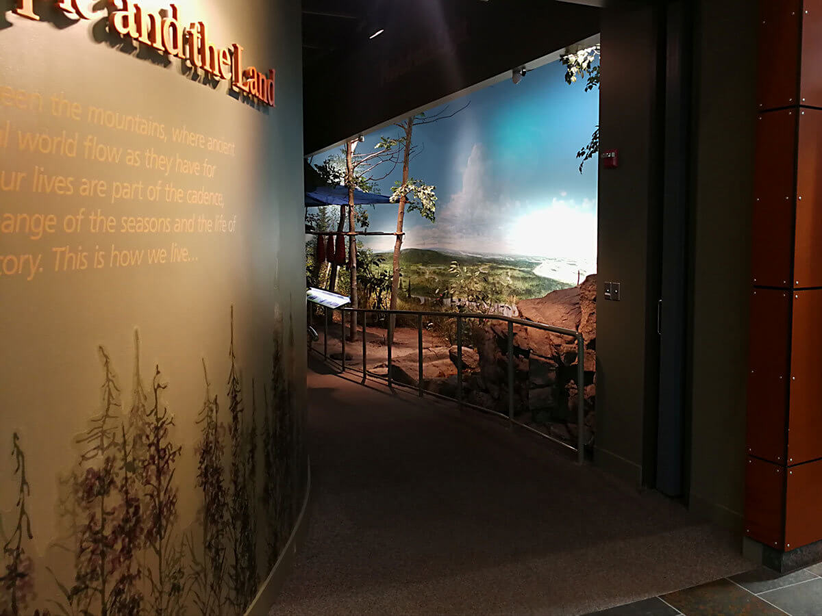 Museum exhibit hall entrance with diorama in background